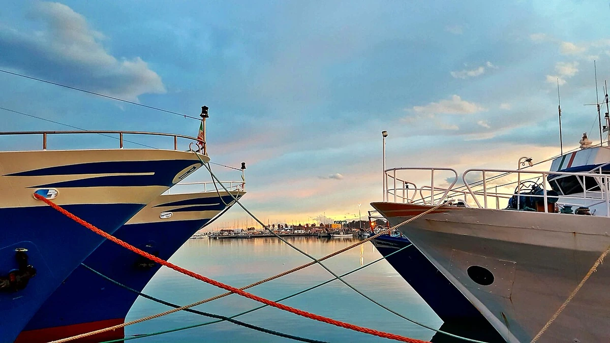 Fishing boats on the quay of the north pier of the port of San Benedetto del Tronto, Italy.