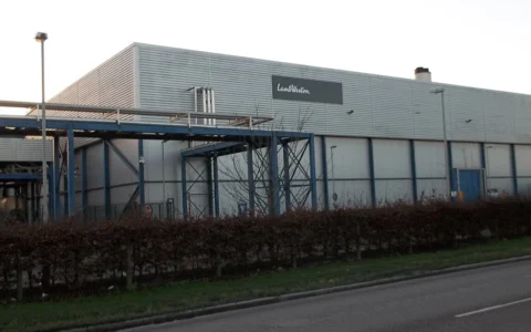 Lamb Weston production facility in Wisbech, England, with the company logo visible on the building.