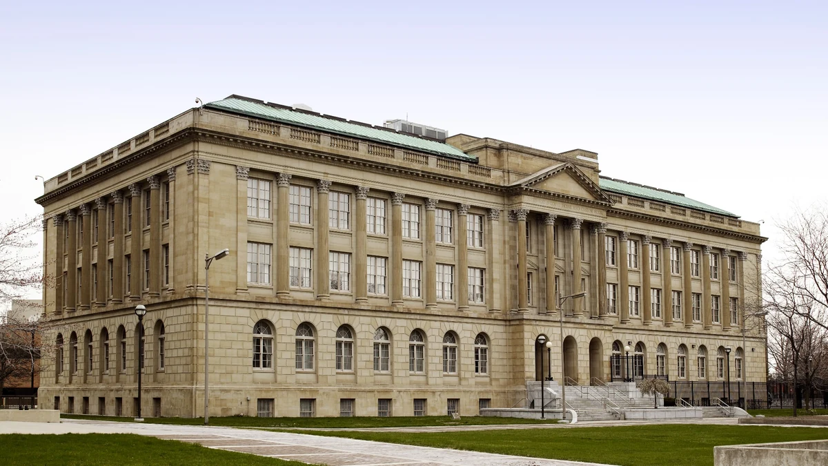 Exterior of the federal courthouse in Toledo, Ohio, with a columned limestone facade and lawn.
