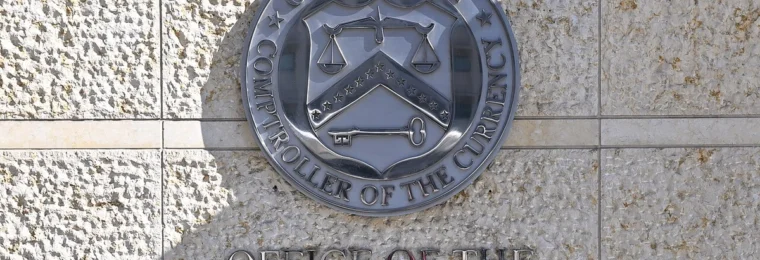 Office of the Comptroller of the Currency wall seal and signage in Washington, D.C.