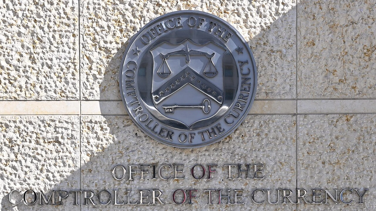 Office of the Comptroller of the Currency wall seal and signage in Washington, D.C.