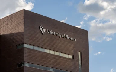 University of Phoenix signage and logo on a campus building in Phoenix, Arizona.