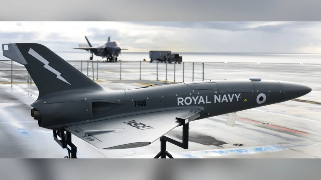 A QinetiQ Banshee target drone on the flight deck of the Royal Navy aircraft carrier HMS Prince of Wales during a 2021 trial.