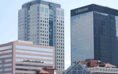 Downtown Birmingham buildings including the Regions Center with Regions signage visible.