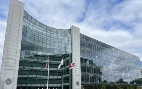 Exterior of the U.S. Securities and Exchange Commission headquarters in Washington, D.C., with flags in front.