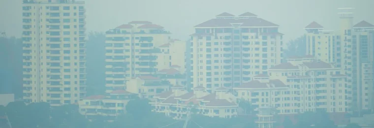 Haze obscures high-rise residential buildings and a waterfront in Tanjong Rhu, Singapore, on September 14, 2026.