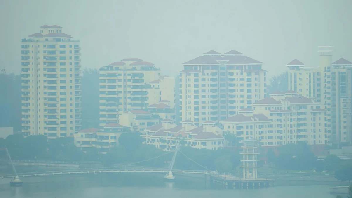 Haze obscures high-rise residential buildings and a waterfront in Tanjong Rhu, Singapore, on September 14, 2026.
