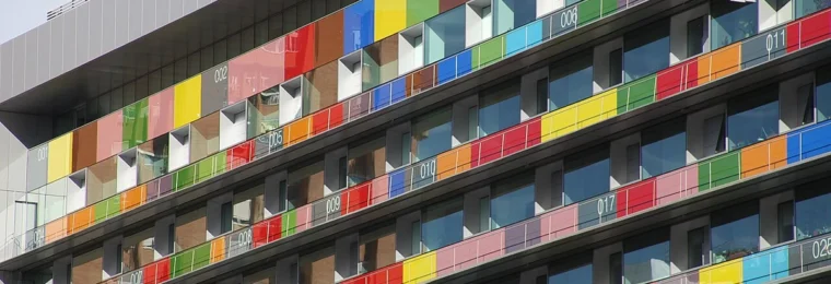 Multicolored numbered panels on the facade of Spain’s National Statistics Institute headquarters in Madrid.