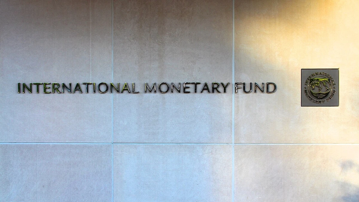 International Monetary Fund headquarters sign and emblem on a stone exterior wall in Washington, D.C.