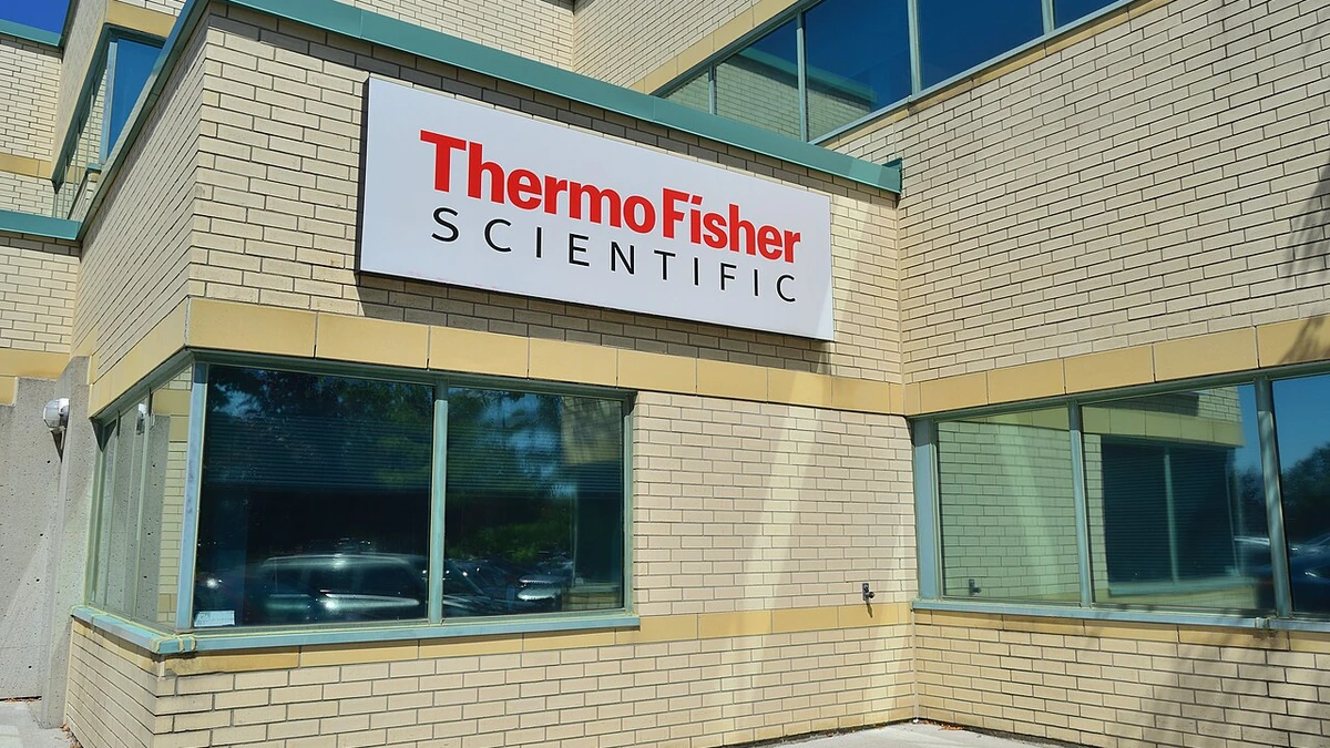 Thermo Fisher Scientific sign on a brick office building in Markham, Ontario.