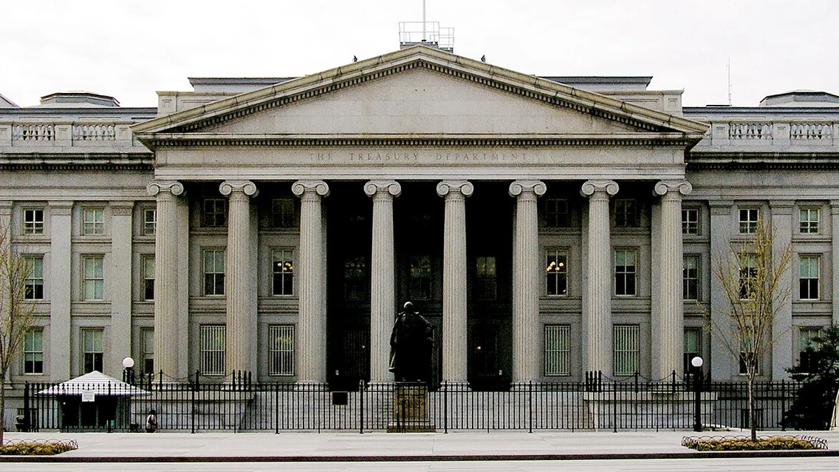 Front facade of the U.S. Treasury Department building in Washington, D.C., with columns and a central statue.