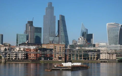 The City of London financial district skyline viewed across the River Thames.