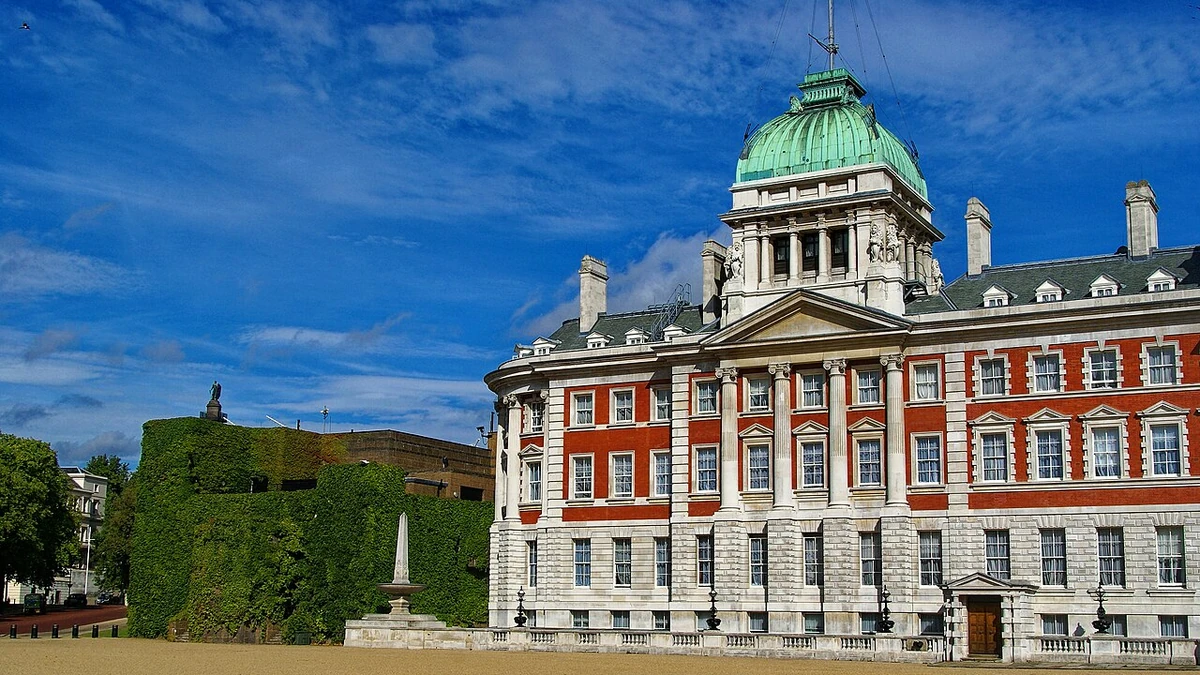 The Old Admiralty Building and adjoining Admiralty Citadel seen from Horse Guards Parade in London, with a green copper dome.
