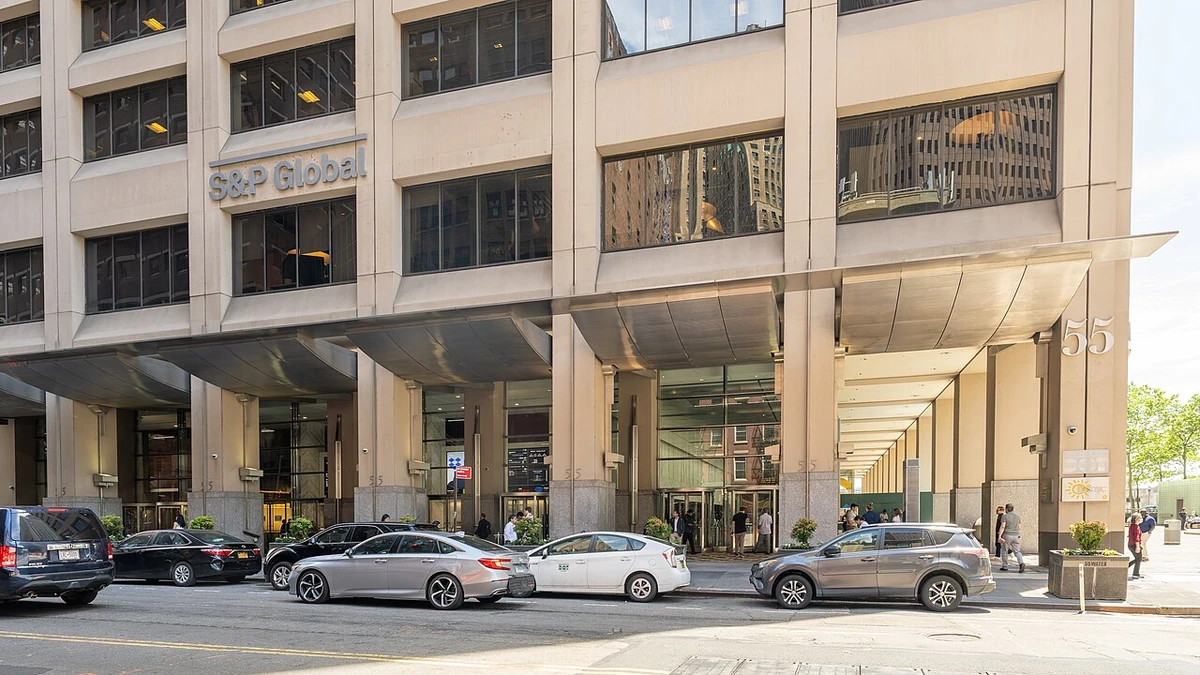 S&P Global sign on the exterior of its office building at 55 Water Street in Manhattan, New York.