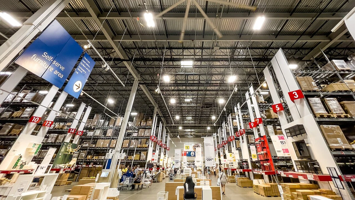 Interior of the IKEA New Haven warehouse area in Connecticut, with shelves of boxed inventory and a self-serve furniture section.