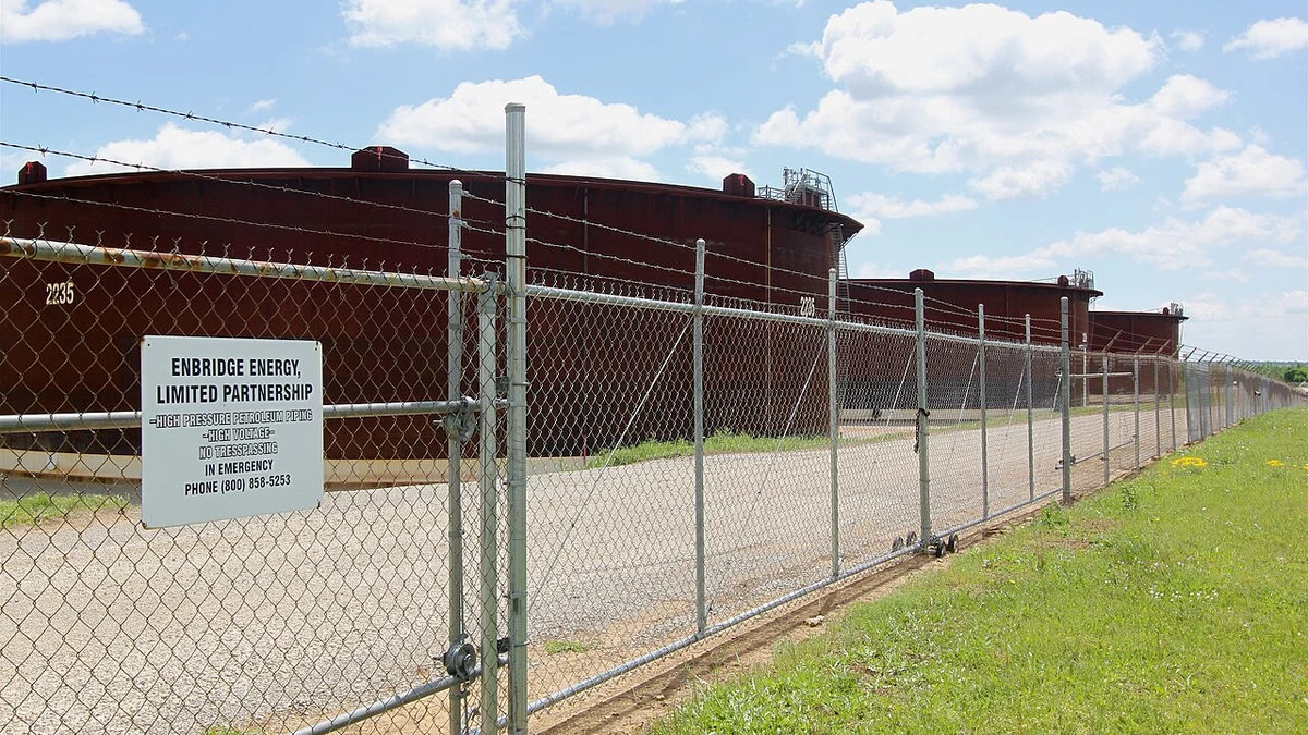 Crude oil storage tanks behind a security fence at the Enbridge tank farm in Cushing, Oklahoma.