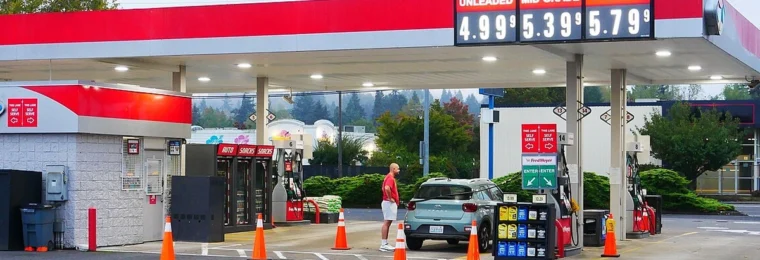 Gas station with posted prices for regular, mid-grade and premium gasoline.