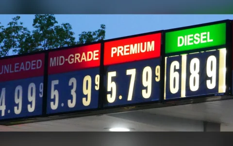 Gasoline and diesel prices displayed on an illuminated station sign in Eugene, Oregon, in September 2026.