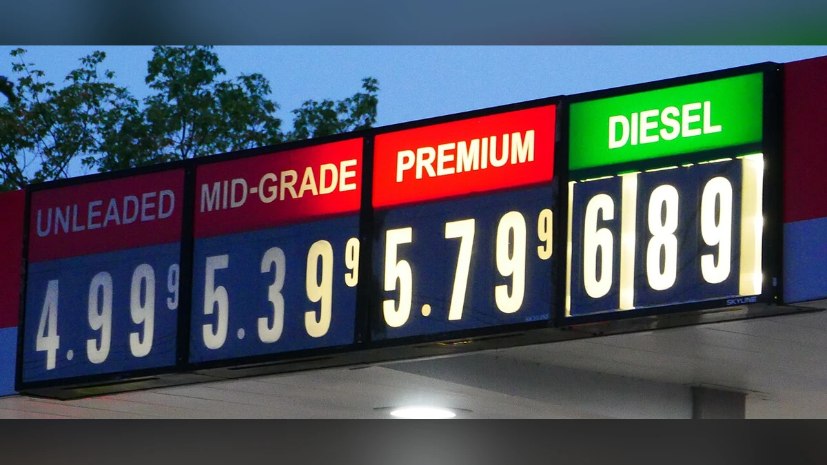 Gasoline and diesel prices displayed on an illuminated station sign in Eugene, Oregon, in September 2026.