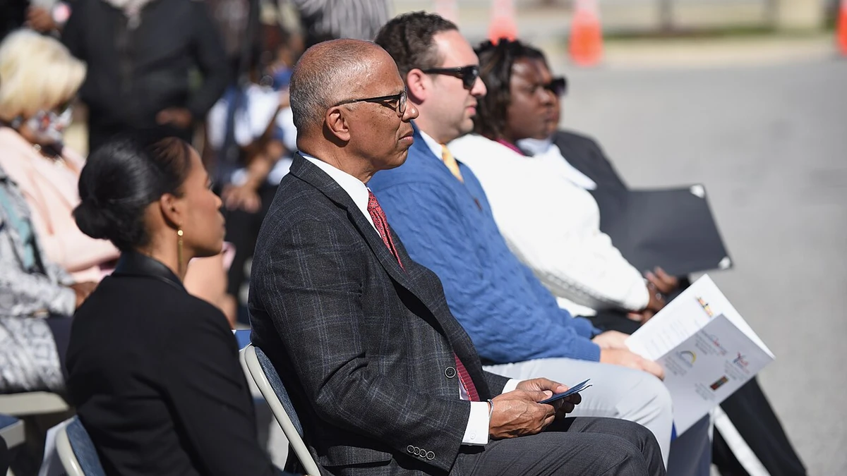 Attendees seated outdoors at the grand opening of the American Job Center in National Harbor, Maryland.