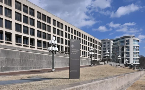 Sign for the United States Department of Labor in front of the Frances Perkins Building in Washington, D.C.