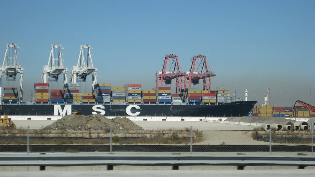 Container ship MSC Lucy being loaded with shipping containers at the Port of Long Beach in California.