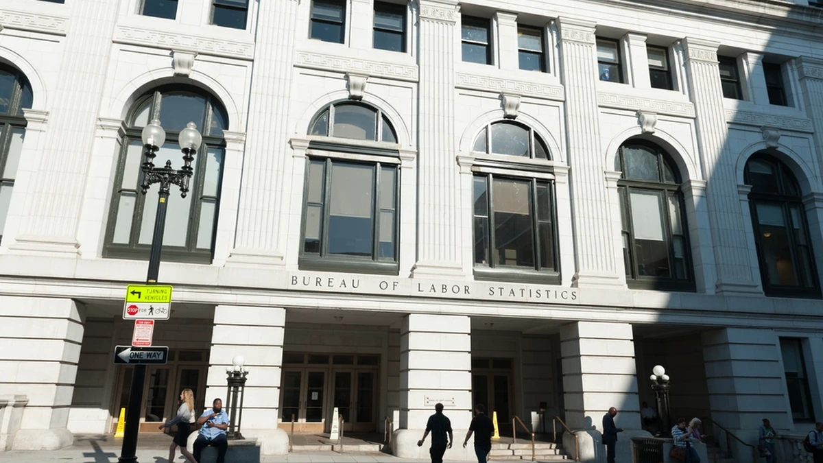 Entrance to the Bureau of Labor Statistics in Washington, D.C., with the agency name visible above the doors.