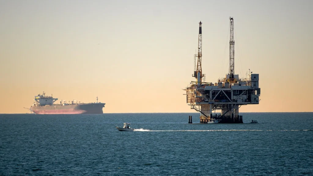 Offshore oil platform and ships at sea.