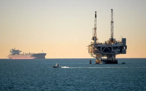 Offshore oil platform and ships at sea.