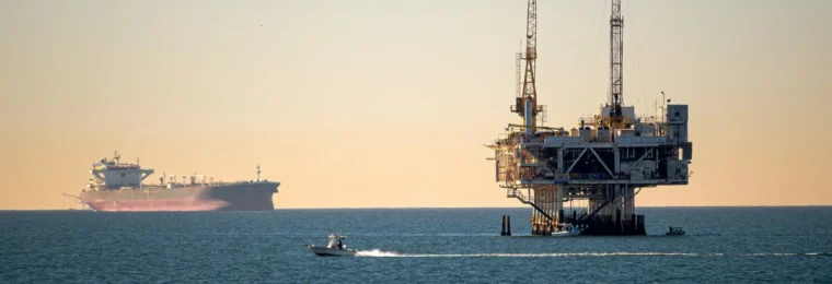 Offshore oil platform and ships at sea.