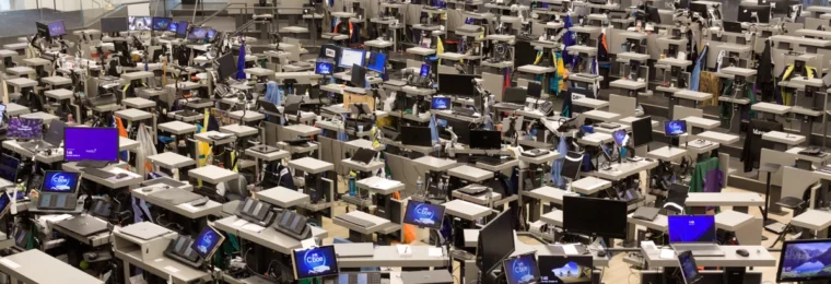 Rows of trading terminals and Cboe-branded screens on the trading floor inside the Chicago Board of Trade Building.