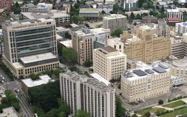 Aerial view of Harborview Medical Center in Seattle, showing the main hospital tower and surrounding medical campus.