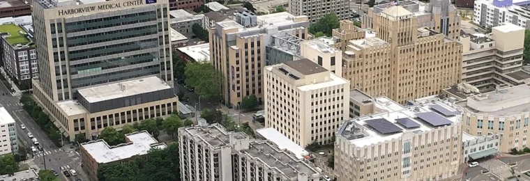 Aerial view of Harborview Medical Center in Seattle, showing the main hospital tower and surrounding medical campus.