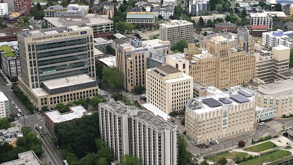 Aerial view of Harborview Medical Center in Seattle, showing the main hospital tower and surrounding medical campus.