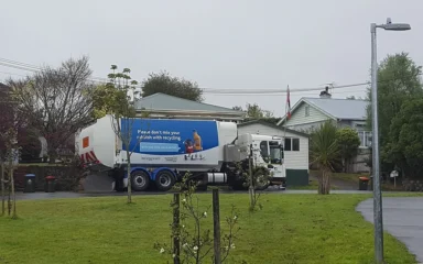 A rubbish collection truck on Cardigan Street in Auckland’s St Lukes and Western Springs area.